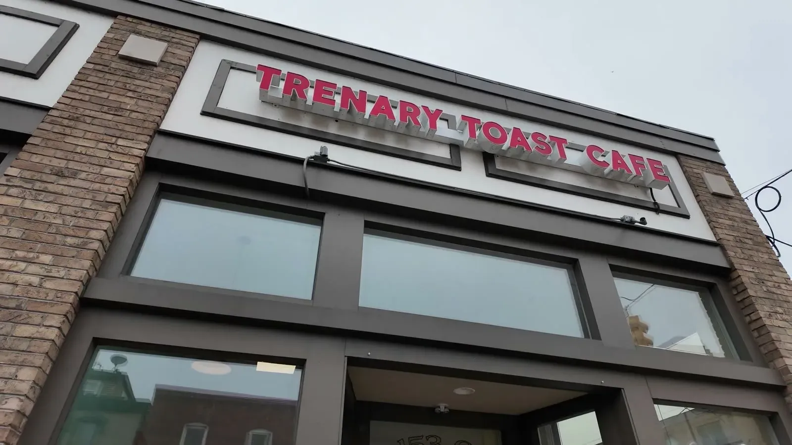 The Trenary Toast Cafe storefront and sign at the corner of Third and Washington in downtown Marquette.