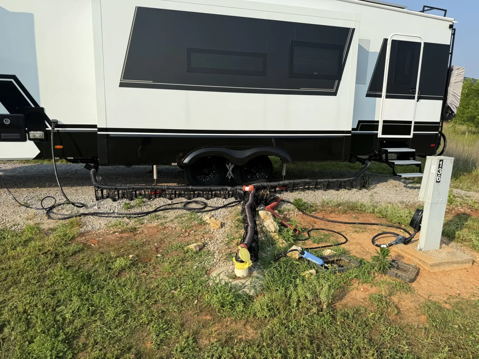 Sewer, water and power all connected at site 136 at Ditto Landing, with the hookup box cover lifted off
