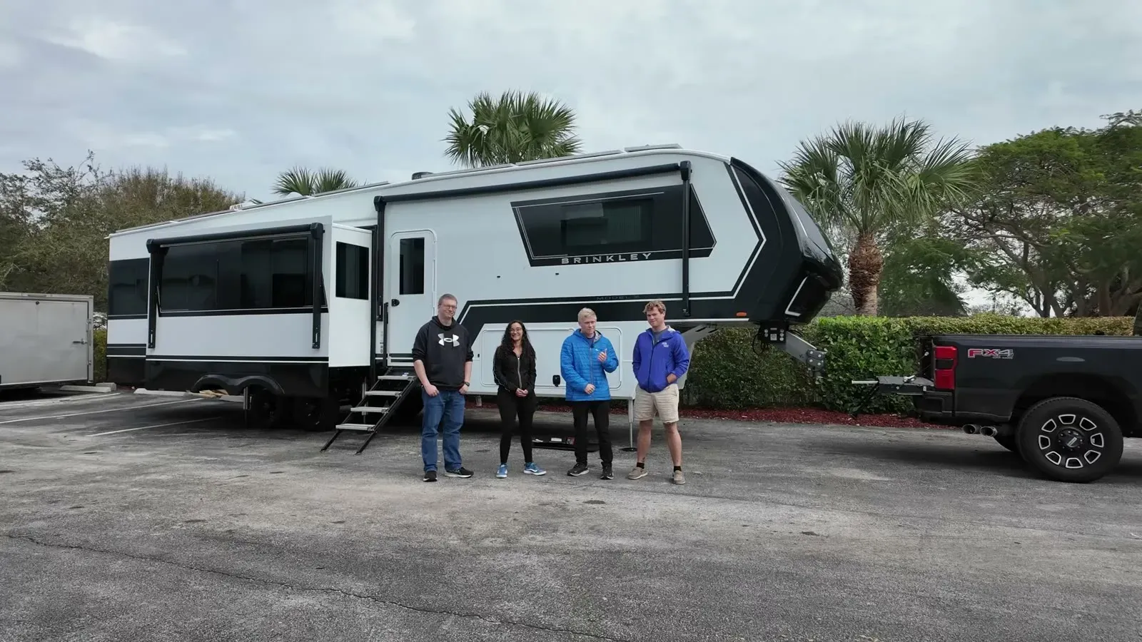 Standing with the Mobile Solar Consulting crew in front of our Brinkley Model Z 3515 on pickup day, truck hitched and ready.