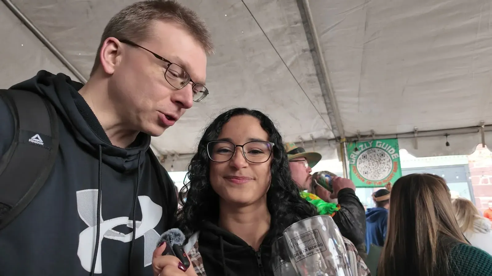 Waiting in line under the Ore Dock beer tent with our tokens and commemorative festival mugs.