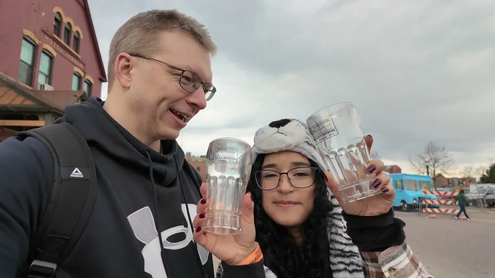 Raising our empty festival mugs on the walk back to the car, cold but happy after the Angry Bear.