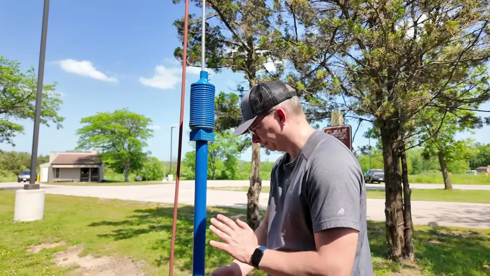 Nathan filling the fresh water tank at the park spigot before a week of boondocking.