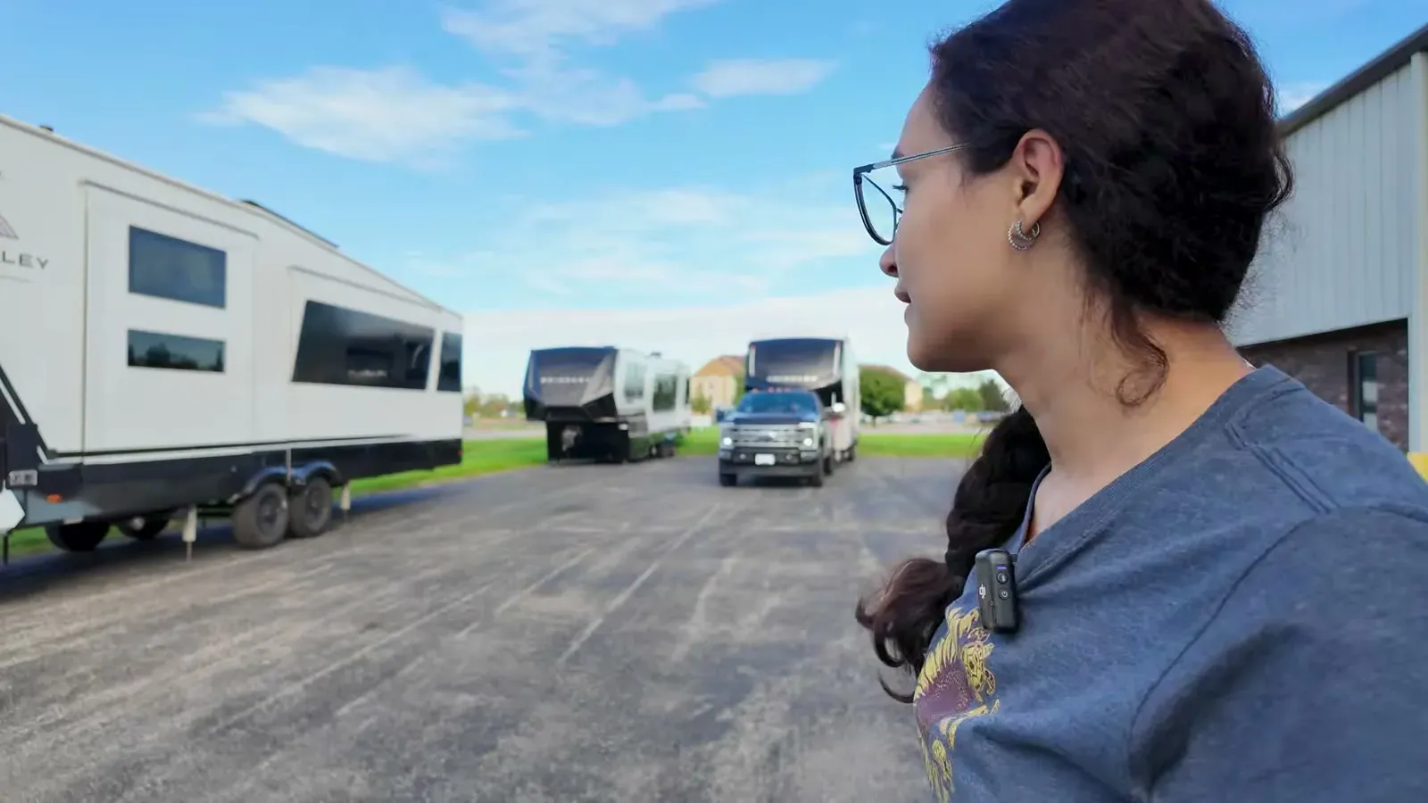 Fabiola looks out over the Brinkley service lot, where a row of fifth wheels and our truck wait for morning appointments.