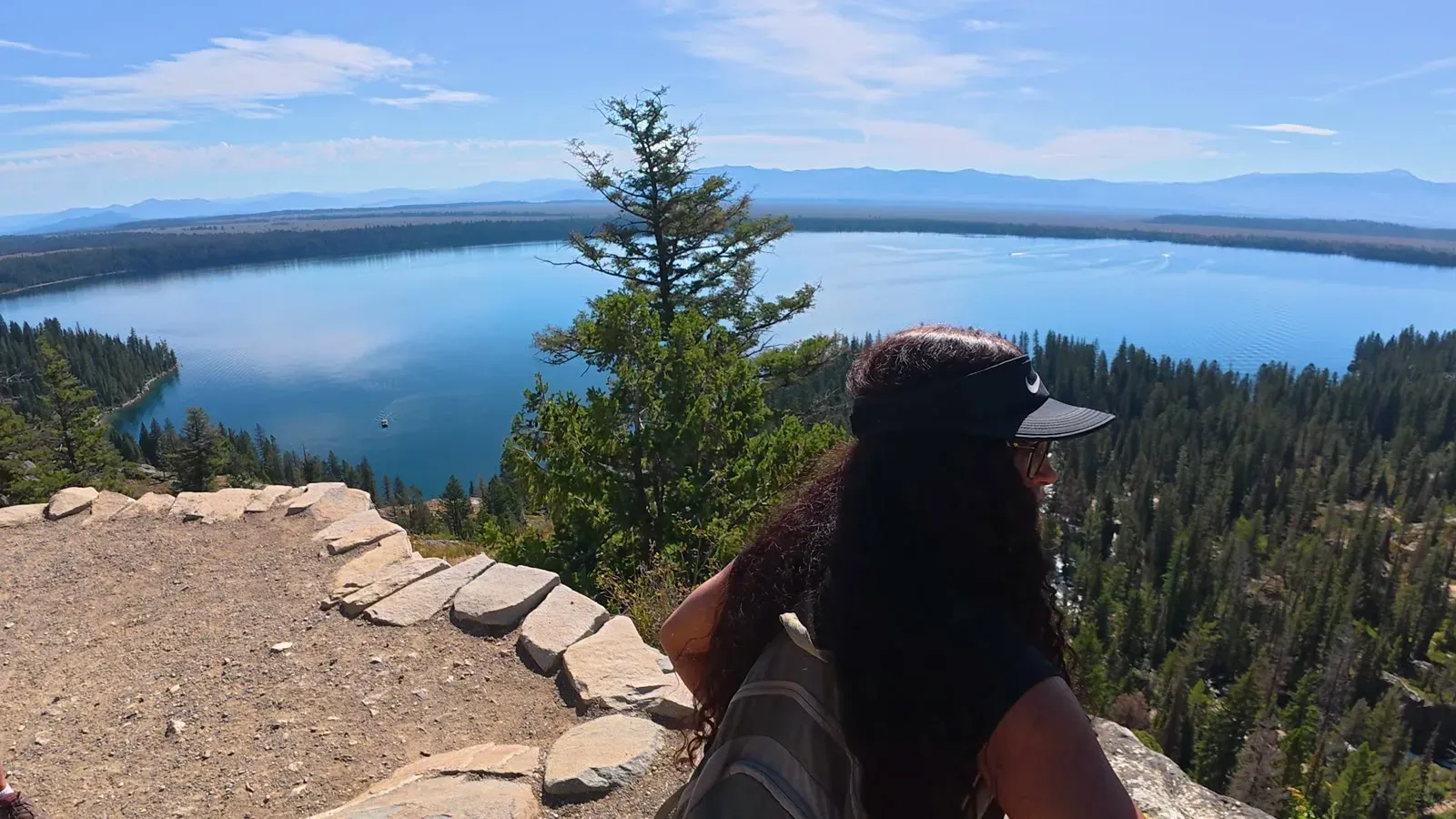 Fabiola at Inspiration Point looking down over Jenny Lake and the forest below