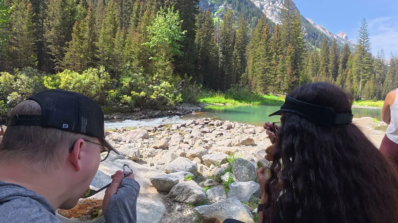 Nathan and Fabiola eating the lunch we packed, sitting by a rocky creek in Cascade Canyon