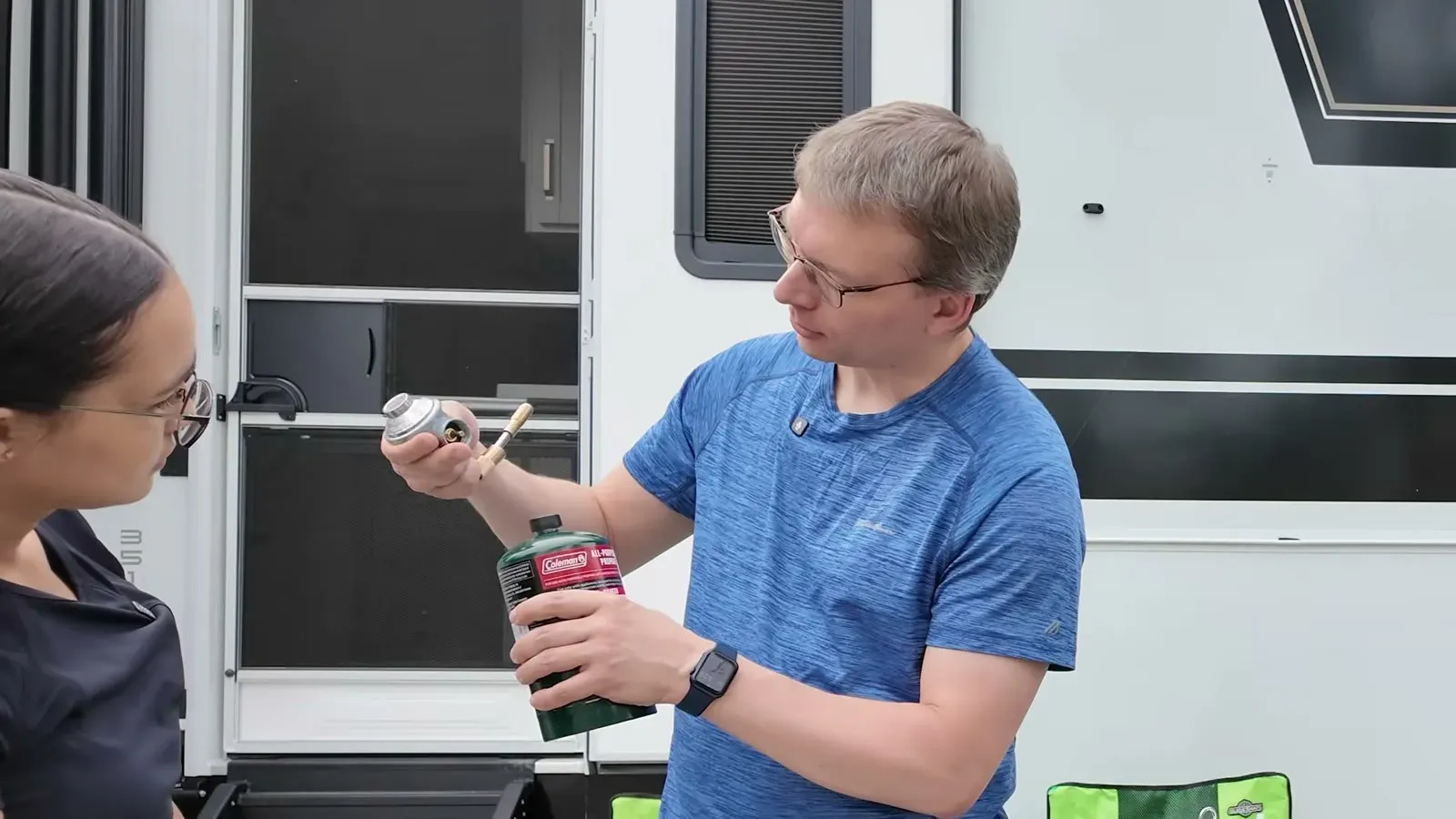 Nathan holds up the one pound Coleman propane bottle we grabbed at Walmart after the onboard hookup plan fell through.