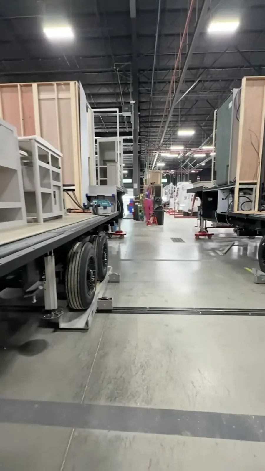 Model Z fifth wheels lined up mid-build on the Brinkley factory floor, framing still exposed.