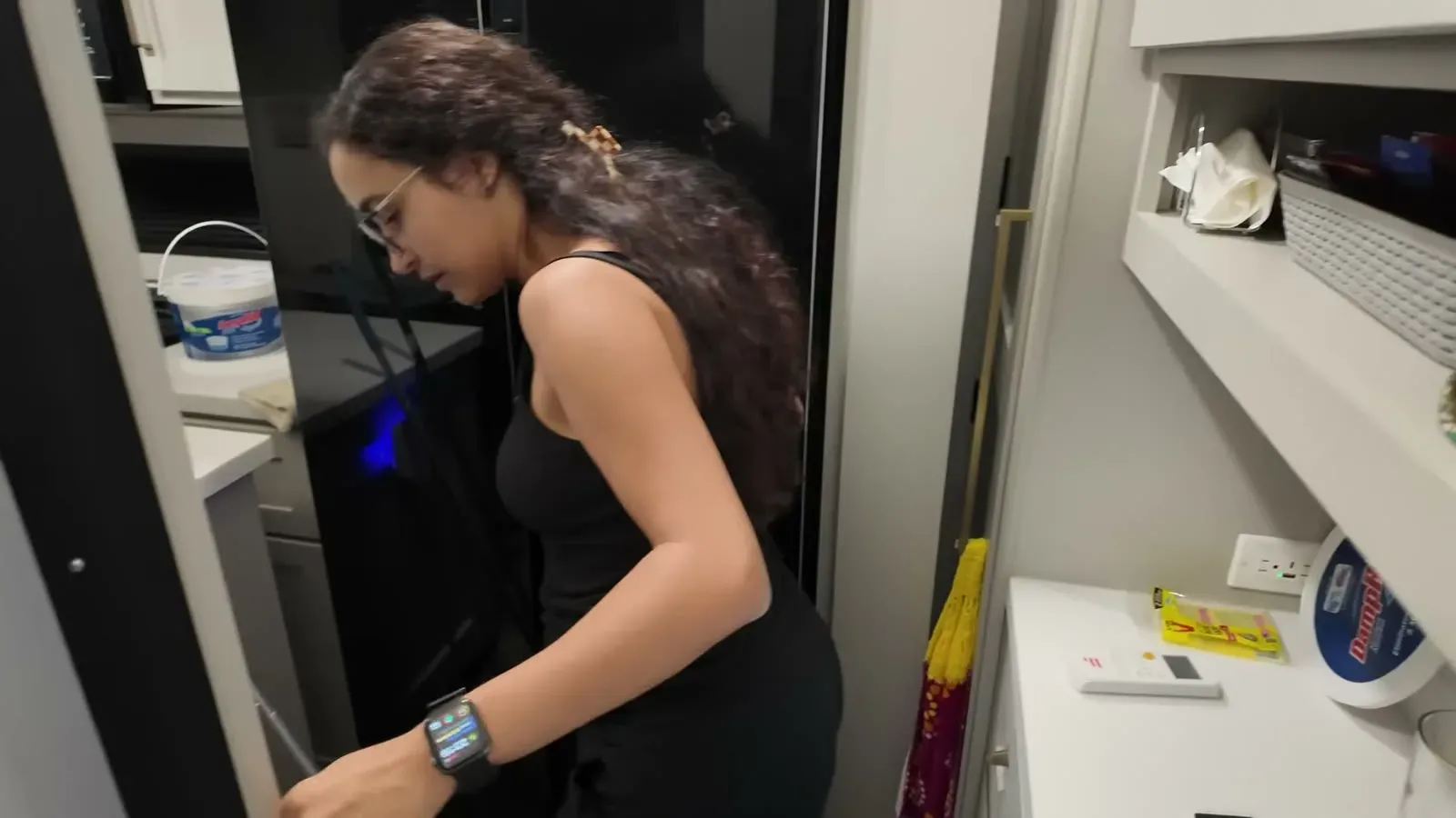 Fabiola peers into a dark storage closet during our first post-storage walkthrough of the Brinkley.