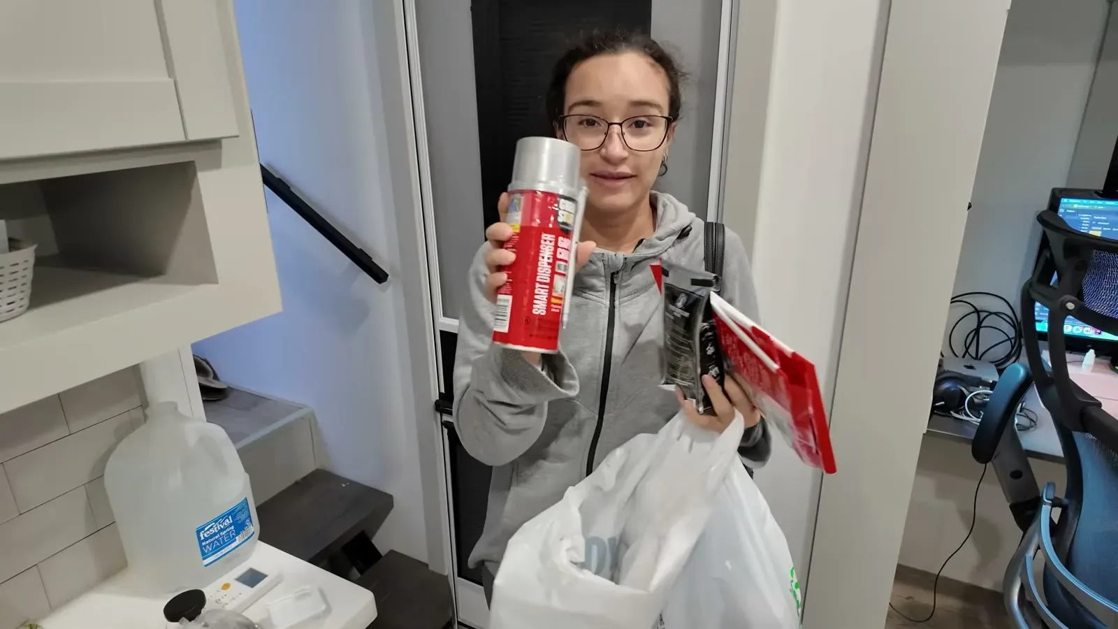 Fabiola back from the store with a bag full of traps, bait, and a can of rodent repellent spray.