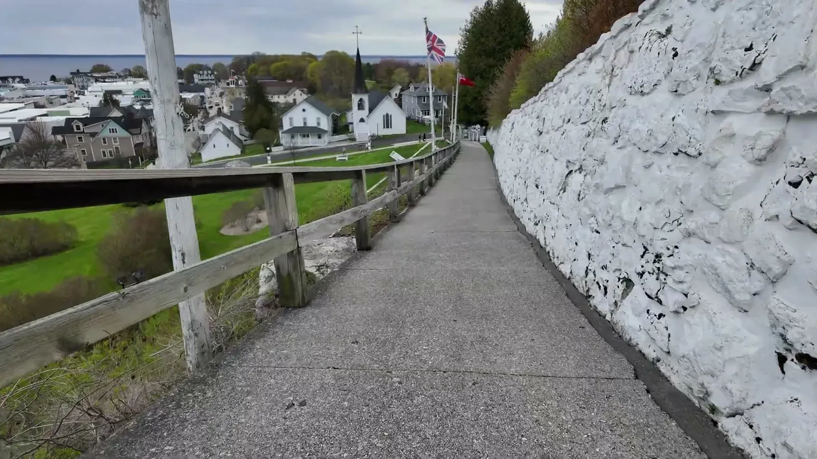 The white stone path below Fort Mackinac looking down over the church steeples and rooftops of town.
