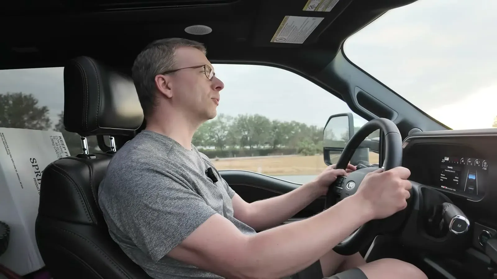 Nathan at the wheel of the F-350 while we called around trying to line up a potable water fill.