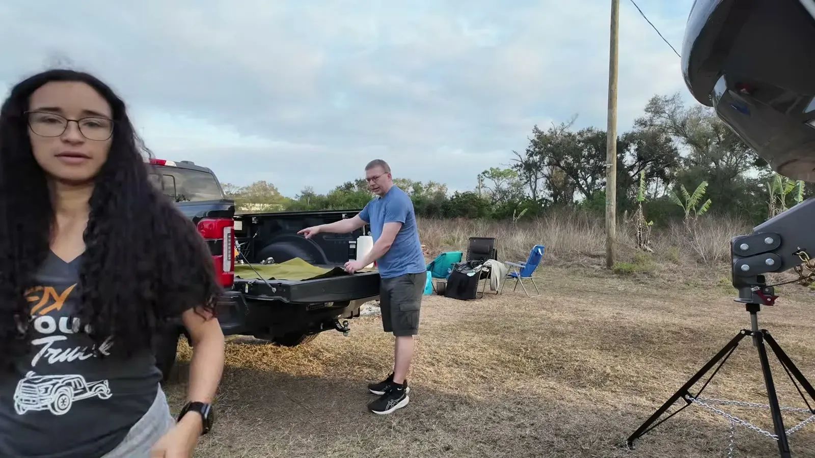 Nathan lays the AQUATANK2 bladder out in the truck bed while Fabiola supervises the first-ever setup.