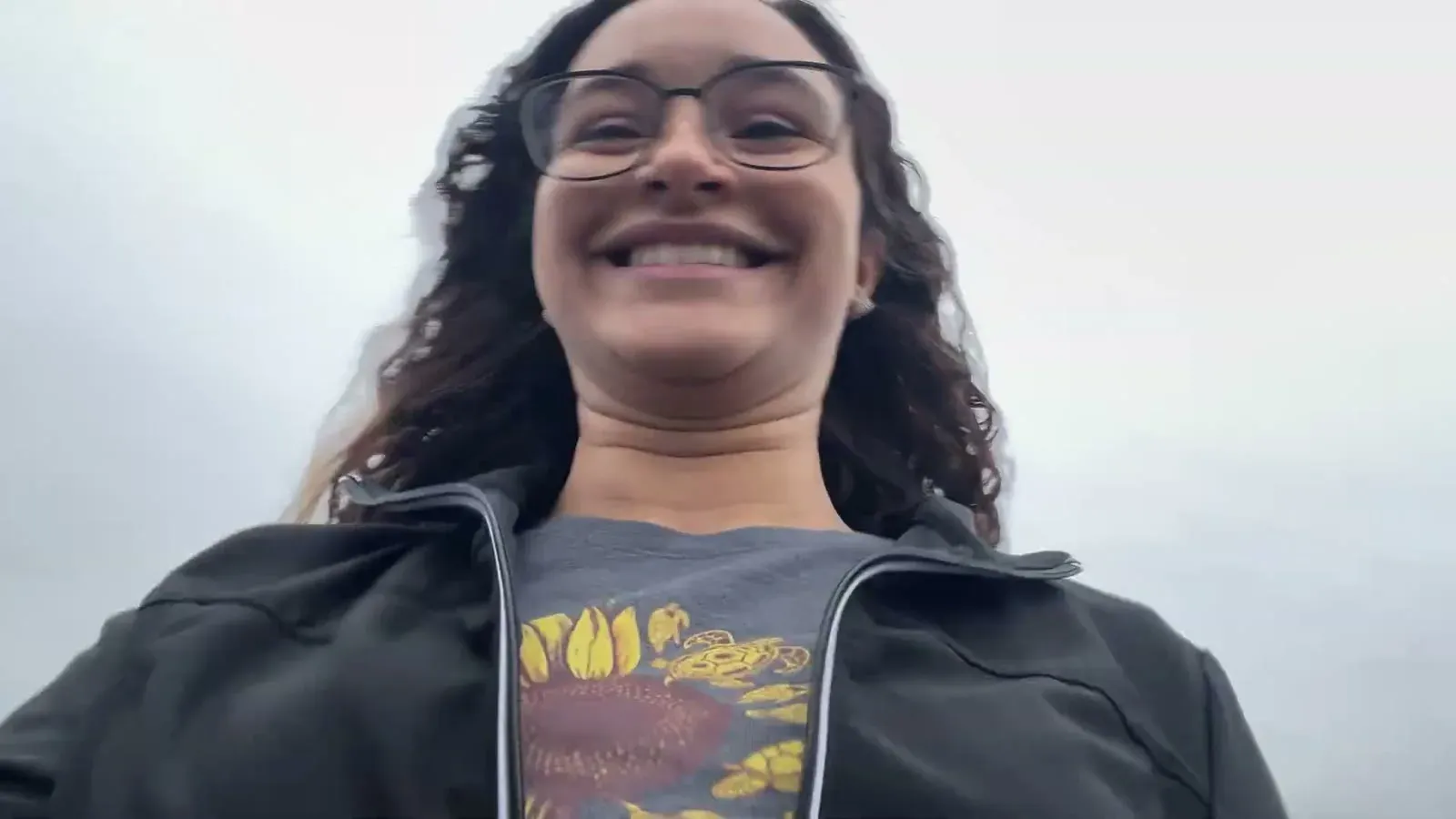 Fabiola grinning at the camera as we scramble out the door, already running late to pick up the Brinkley.
