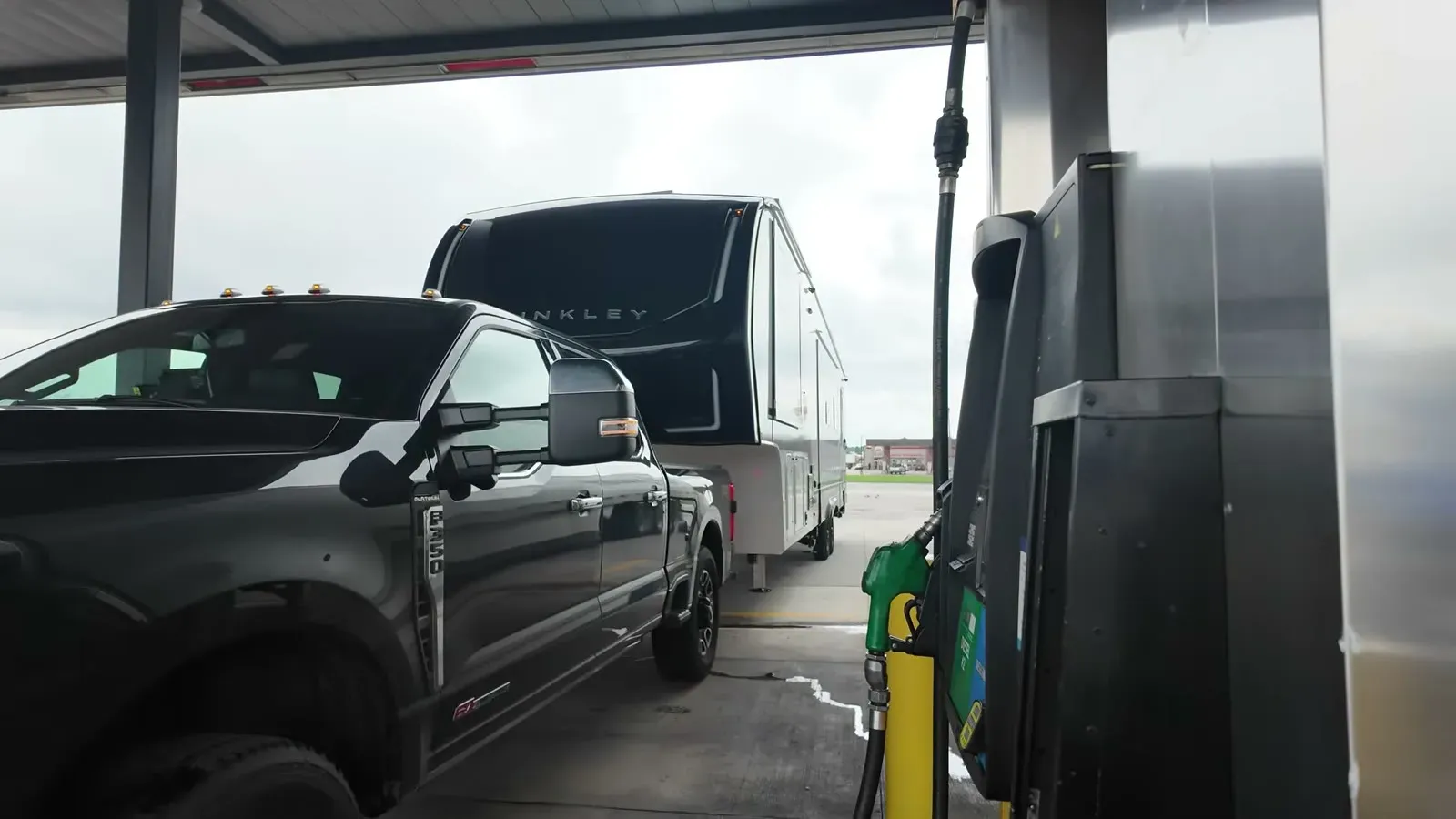 Our truck still hitched to the fifth wheel, squeezed in next to the pumps at Love's for the first fill-up with the RV attached.