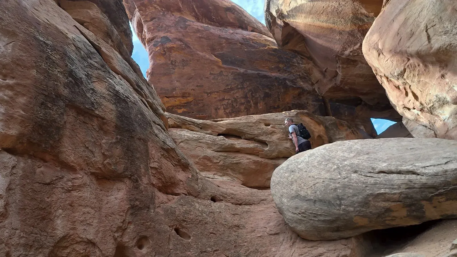 Huge sandstone boulders wedged overhead in the Devils Kitchen rock formation at Colorado National Monument