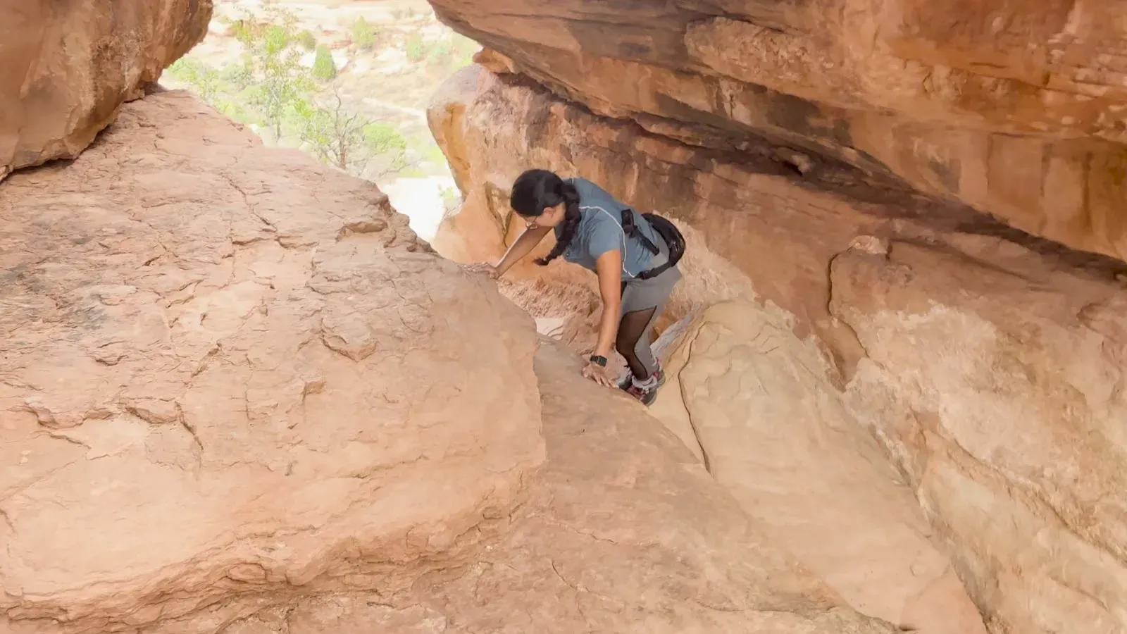Fabiola smiling after climbing up between the sandstone walls of Devils Kitchen