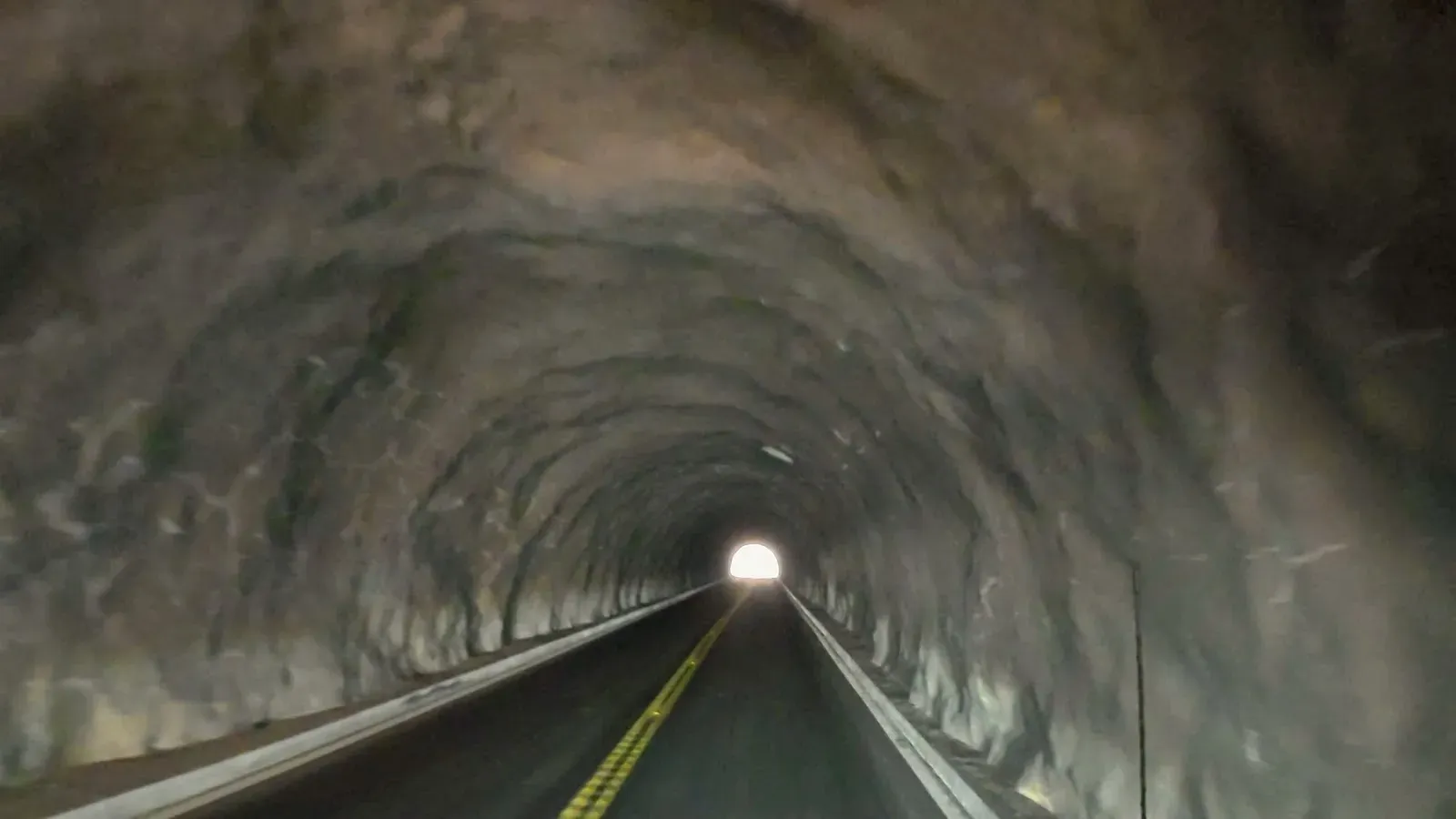 Driving into one of the rock tunnels on Rim Rock Drive
