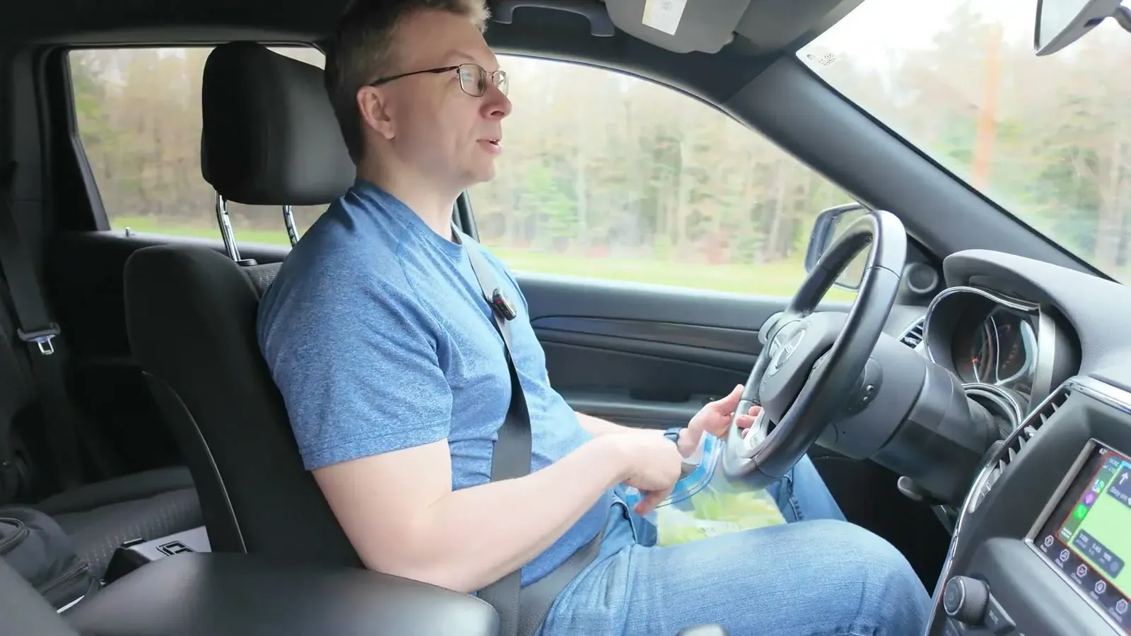 Nathan behind the wheel with the famous chip bag full of chopped lettuce in his lap.