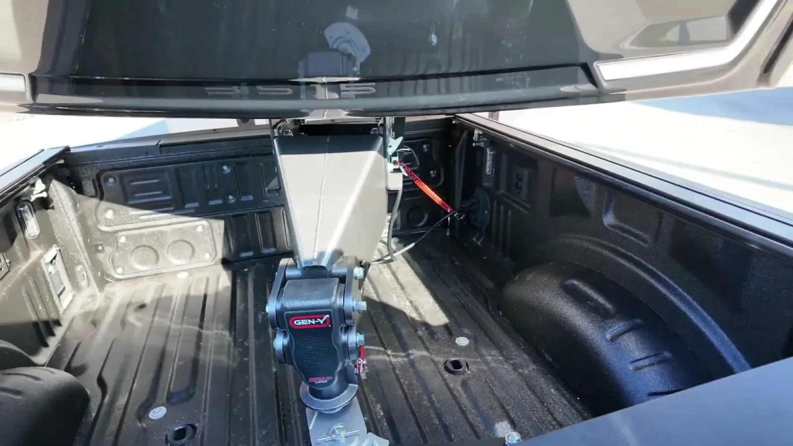 The fifth wheel's SnapLatch coupler latched onto the GEN-Y gooseneck ball in the bed of our F-350