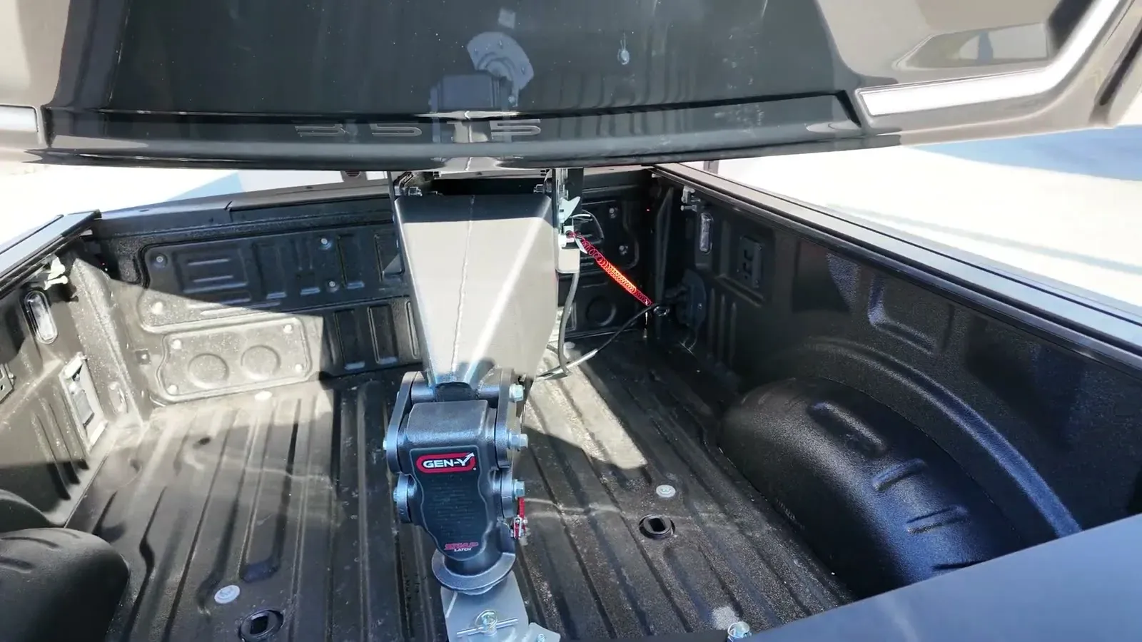 The SnapLatch coupler latched onto the gooseneck ball in the truck bed