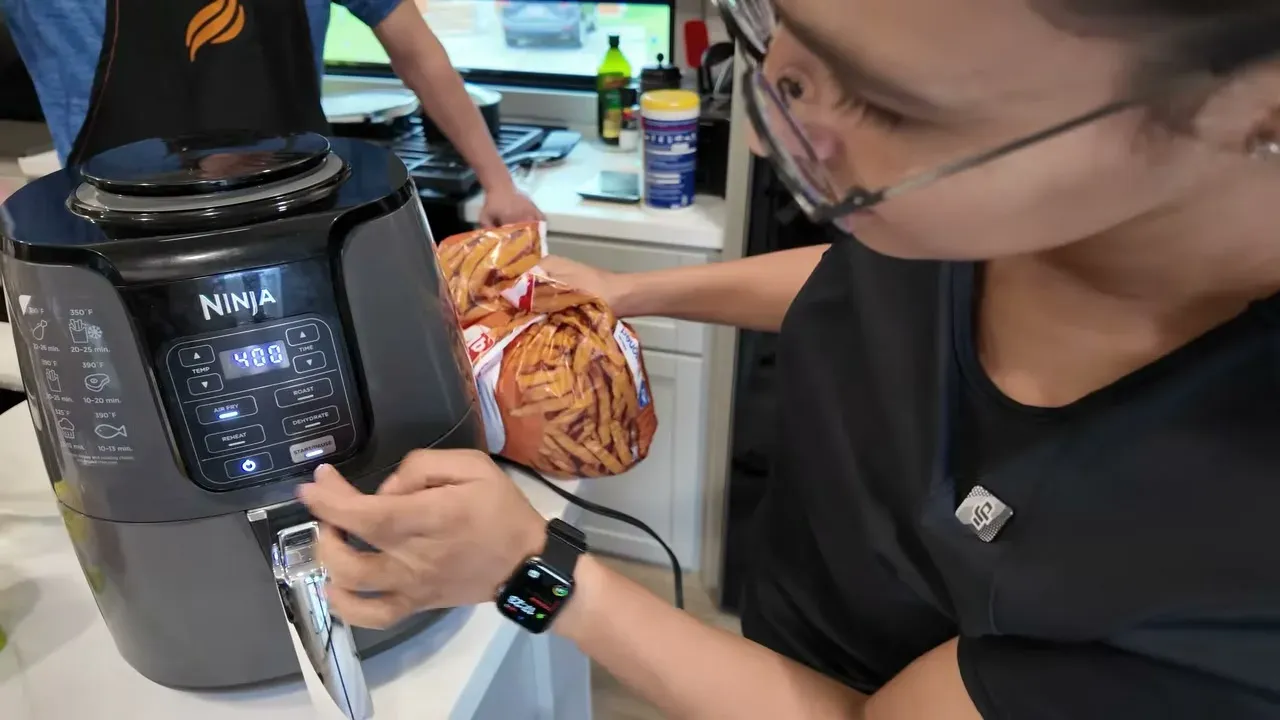 Setting our Ninja air fryer to 400 degrees to crisp fries off-grid in the RV kitchen