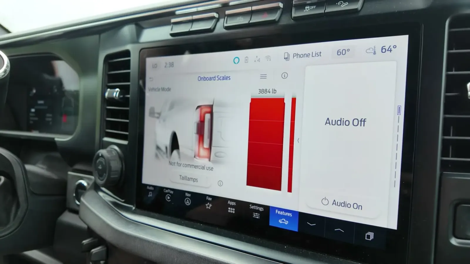 The F-350's onboard scale screen showing the pin weight gauge maxed out in red