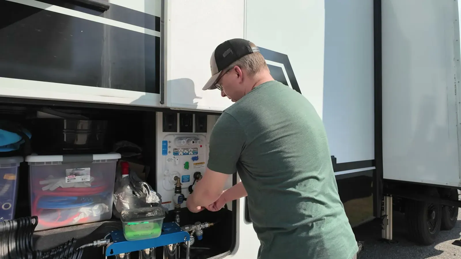 Hooking up the water connection at our pull-through site