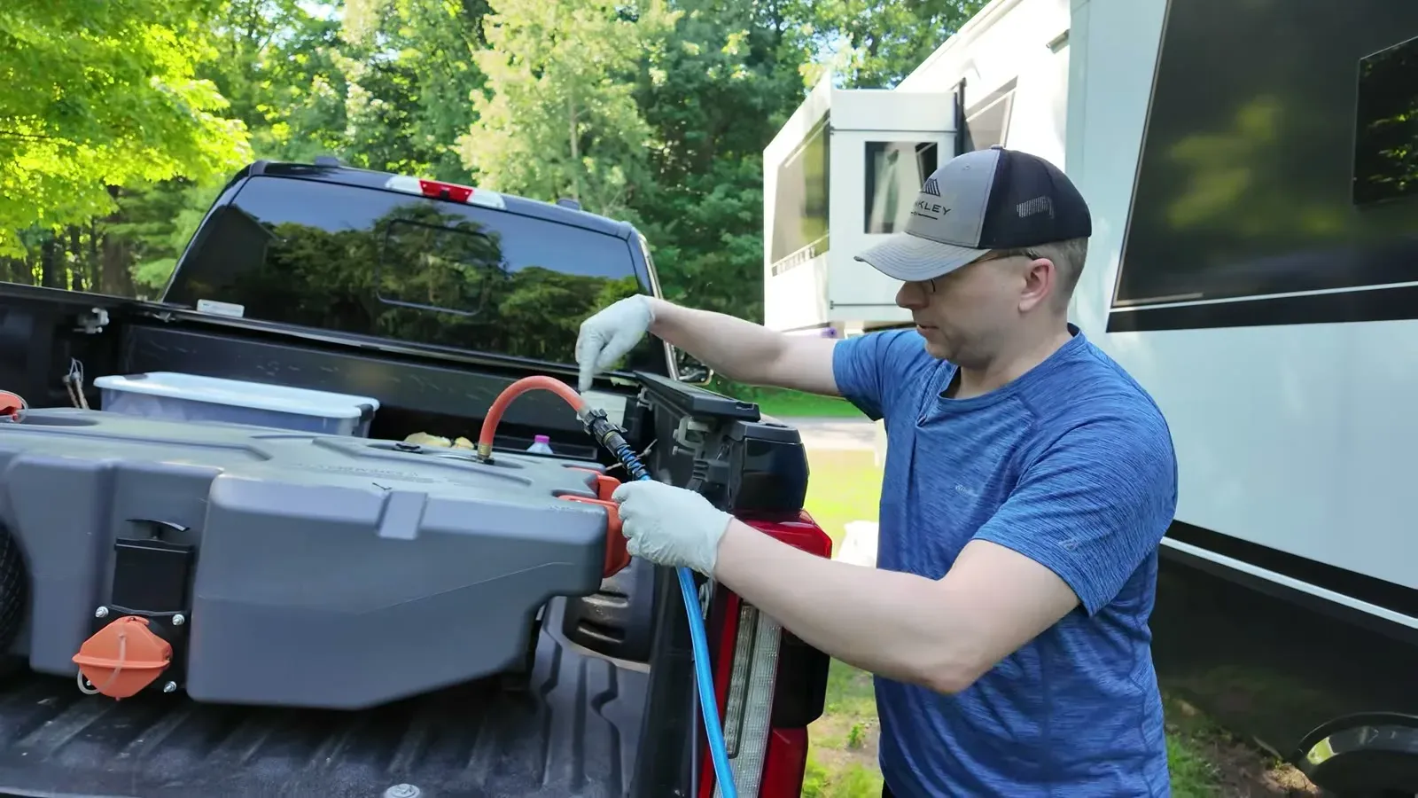 Connecting the macerator pump and hose to the portable waste tank in the truck bed