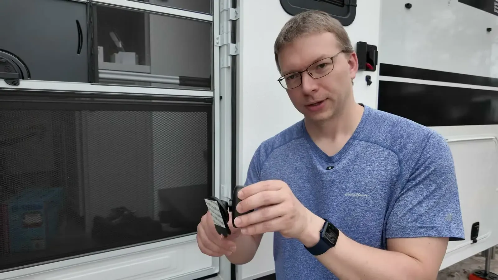 Nathan holding a Blink Outdoor camera before mounting it on the RV for 360-degree security