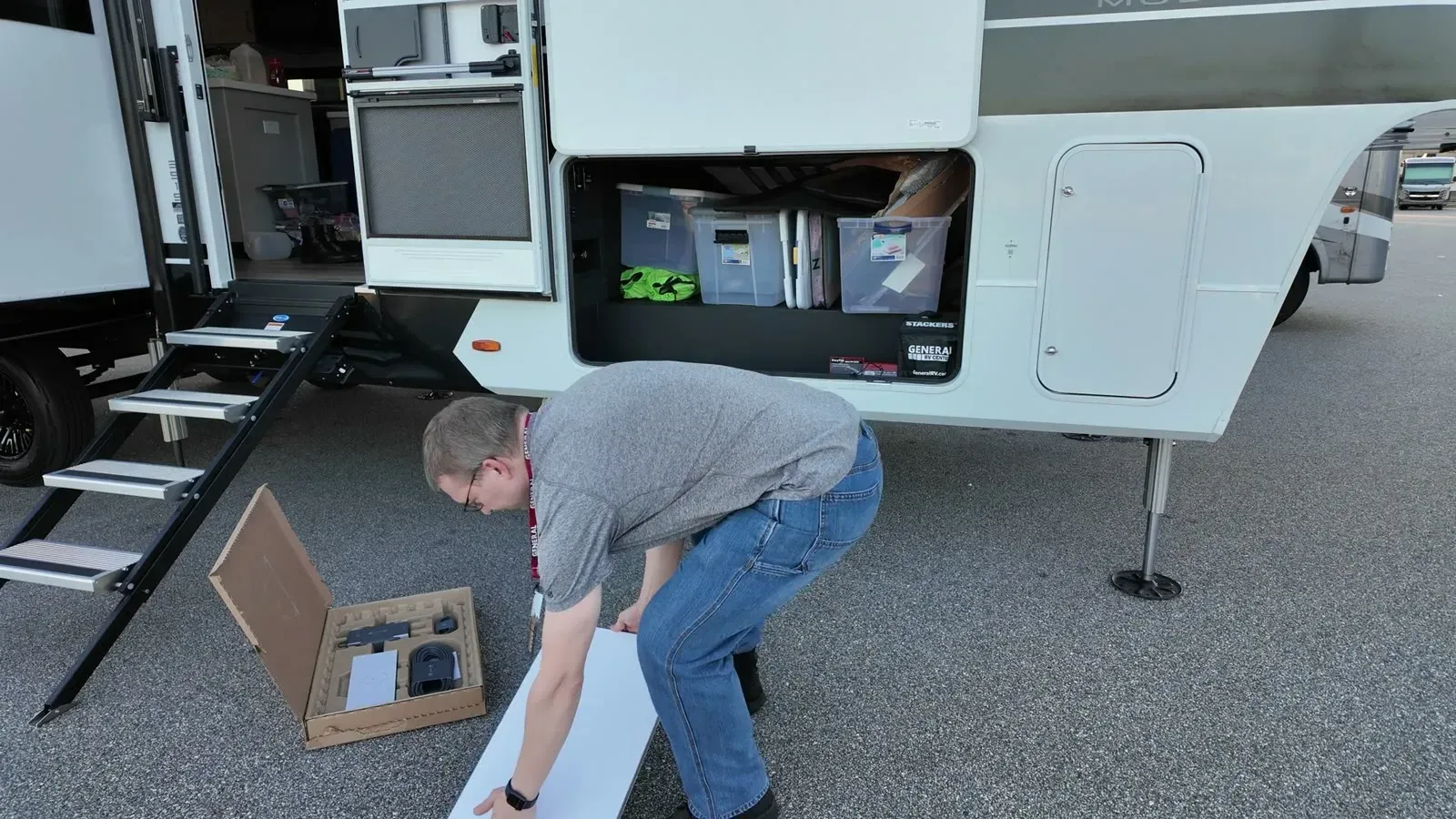 Lifting the Starlink Gen 3 dish out of its box next to the Brinkley