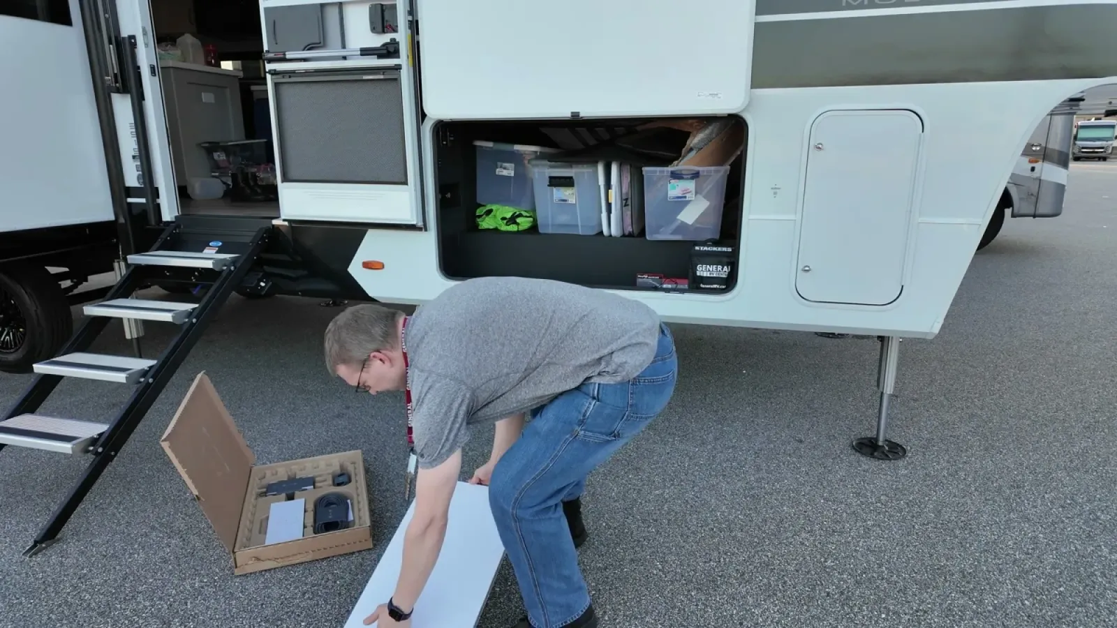 Unboxing the Starlink Gen 3 kit next to the Brinkley's open storage bay