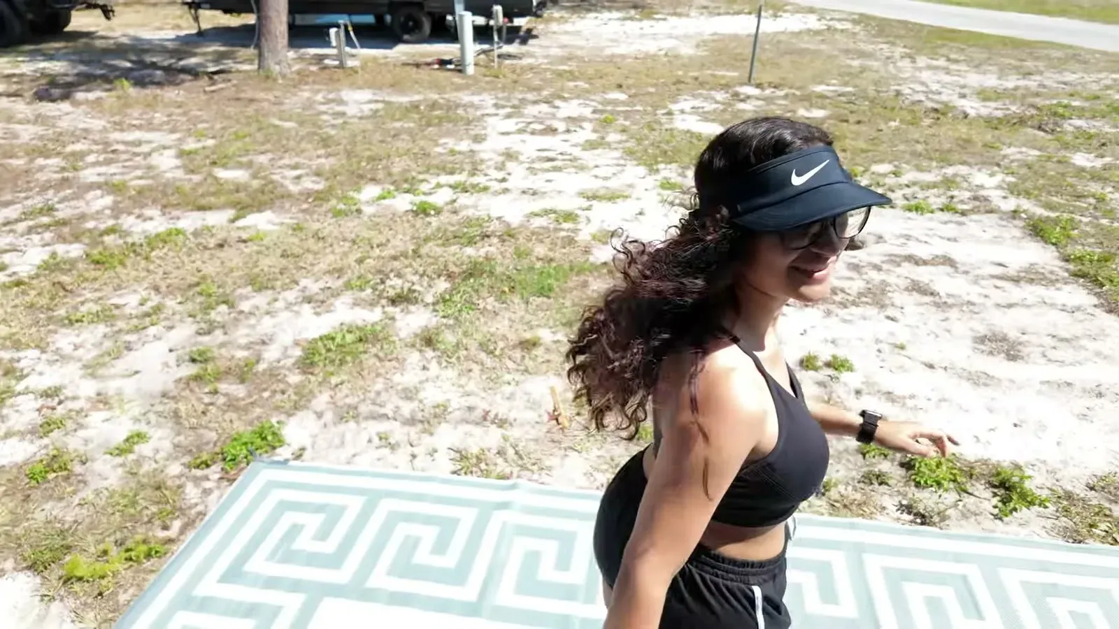 What the mounted camera sees: Fabiola jogging laps past the patio rug to trigger motion alerts.